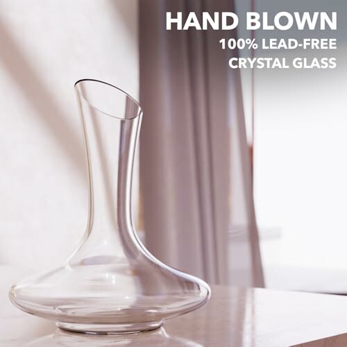 Hand blown lead-free crystal glass decanter on a table.