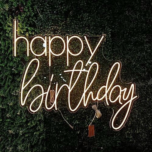 Neon sign reading 'happy birthday' on a green background