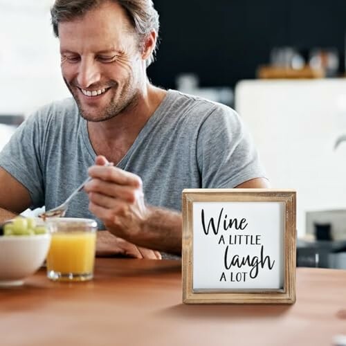 Man enjoying breakfast with motivational quote frame.