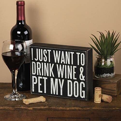 Sign reading 'I just want to drink wine and pet my dog' with wine bottle and glass.