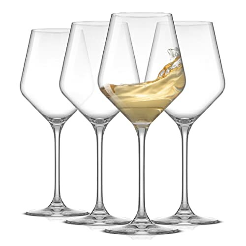 Set of four wine glasses with one filled.