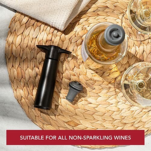 Wine preserver kit with pump and stopper on a woven mat.