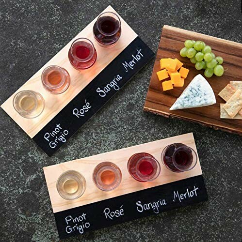 Wine tasting boards with glasses and cheese platter.